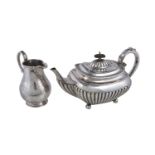 ϒ A silver oblong half reeded teapot and a Victorian cream jug