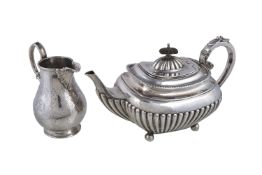 ϒ A silver oblong half reeded teapot and a Victorian cream jug