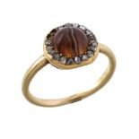 A Victorian agate and diamond ring, the circular cabochon agate within a surround of rose cut