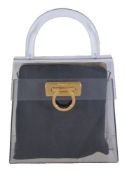 Ferregamo, Gancino, a plexiglass or perspex handbag, with a cream and a black silk liner, no.