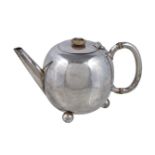 ϒ A Victorian silver ovoid small tea pot by William Hutton & Sons, London 1885, with an ivory button