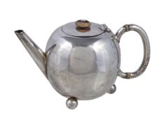 ϒ A Victorian silver ovoid small tea pot by William Hutton & Sons, London 1885, with an ivory button