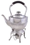 An Edwardian silver oval half fluted kettle on stand by William Hutton & Sons Ltd., Sheffield