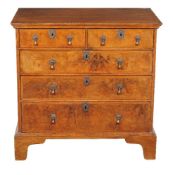 A William & Mary walnut and feather banded chest of drawers, circa 1690, the rectangular top with