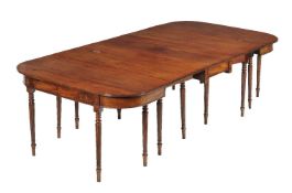 A George III mahogany extending dining table, in the manner of Gillows, circa 1810, the
