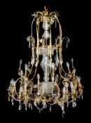 A substantial gilt bronze and glass hung thirty-five light chandelier, late 19th/ early 20th