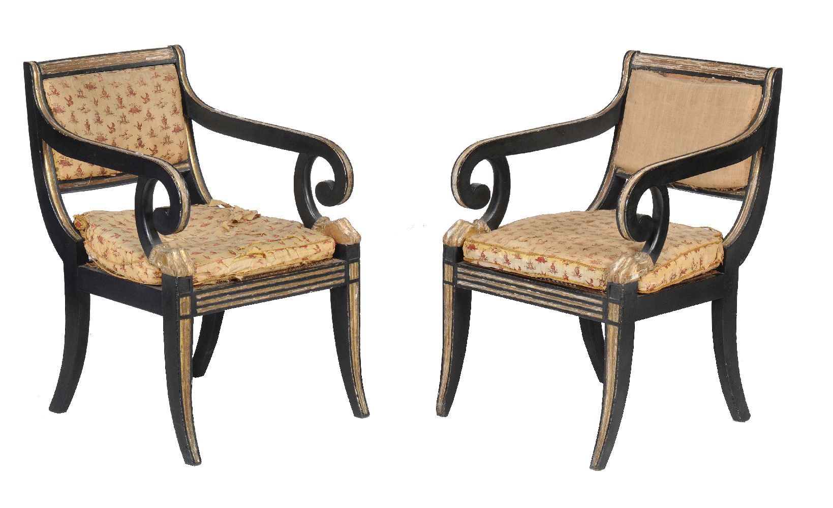 A pair of George III ebonised and parcel gilt armchairs in the manner of Henry Holland, circa