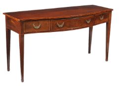 A George III mahogany serpentine fronted serving table, circa 1790, with stringing throughout, the