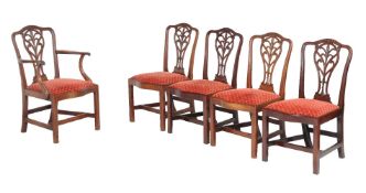 A set of six George III mahogany dining chairs, to include a pair of armchairs, circa 1790, the