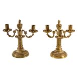 A pair of fine Louis XVI ormolu three light candelabra, late 18th century, the fluted cylindrical
