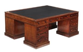 A George IV mahogany partners pedestal desk, circa 1825, the rectangular top with moulded edge and
