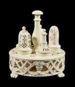 A Wedgwood 'Queen's Ware' cruet stand and associated bottles, circa 1790, the stand with pierced