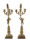 A pair of Empire gilt bronze four light figural candelabra, early 19th century, each with a