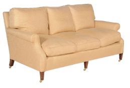 A pair of beech and upholstered three seat sofas of recent manufacture, possibly by George Smith and