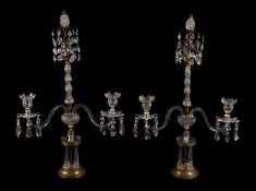 A pair of gilt metal and cut glass twin light lustre candelabra in Regency taste, early 20th