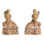 A pair of gilt bronze chenets in late Louis XV style, last quarter 19th century, each cast with