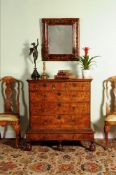 A Queen Anne walnut and feather banded chest on stand, circa 1710, the rectangular quarter