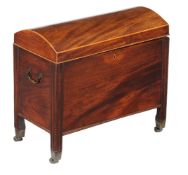 A George III mahogany dome top cellaret, circa 1800, the hinged lid opening to a divided interior