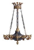 A patinated and gilt bronze twelve light chandelier in Empire style, late 19th century, the