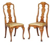 A pair of Dutch walnut and marquetry inlaid side chairs, first half 18th century, the vertical