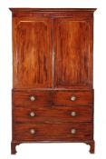 A George III mahogany and sycamore banded clothes press, circa 1800, the moulded cornice