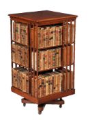 A Victorian walnut revolving bookcase, of 'oversize' scale, circa 1870, the rectangular top above an