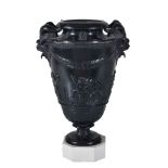 A Herculaneum black basalt two-handled vase, early 19th century, supported on a white dry-bodied