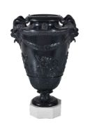 A Herculaneum black basalt two-handled vase, early 19th century, supported on a white dry-bodied