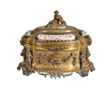 A French gilt metal and enamelled casket by Tahan of Paris, circa 1870, of oval section, the domed