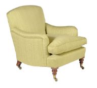 A Victorian walnut and upholstered armchair by HOWARD & SONS, circa 1870, the shaped back and arms