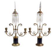 A pair of Regency brass and glass twin light lustre candelabra, circa 1815, each with faceted