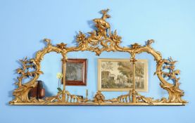 A giltwood over mantel mirror, 19th century, the triptych plate divided by architectural columns and