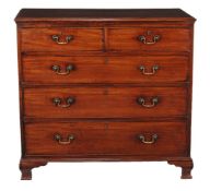 A George III mahogany chest of drawers, circa 1780, the moulded rectangular top above two short