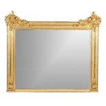 A William IV carved giltwood wall mirror, circa 1835, the rectangular plate within a mottled frame