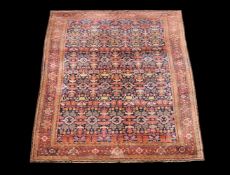 A Teftez carpet, the blue field profusely decorated with geometric floral and foliate motifs in