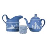 A Wedgwood solid-blue Jasper small teapot and cover, circa 1790, sprigged in white with 'Domestic