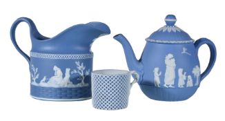 A Wedgwood solid-blue Jasper small teapot and cover, circa 1790, sprigged in white with 'Domestic