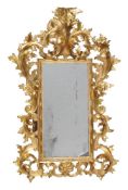 A pair of Florentine giltwood wall mirrors, late 19th/early 20th century, each rectangular plate