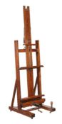 A Victorian oak artist's adjustable studio easel, by Winsor & Newton, of typical form, the crank