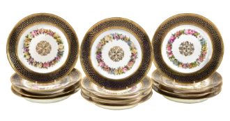 Twelve Louis XVIII Sevres hardpaste porcelain dessert plates, circa 1820, with central gilt