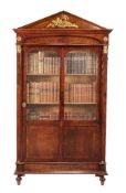A pair of Louis Philippe plum pudding mahogany and gilt metal mounted bookcases, circa 1840, the