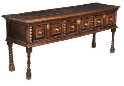 A Charles II oak dresser base, circa 1670, the rectangular top above three mitre moulded drawers,