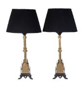 A pair of gilt and patinated metal table lamps in Regency Gothic revival taste, 20th century, the