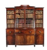 ϒ A Regency mahogany and ebony inlaid library bookcase, circa 1815