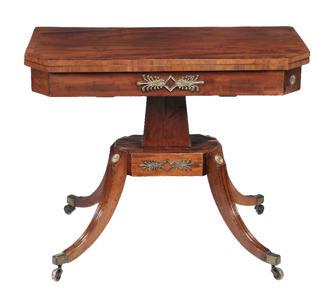 A Regency mahogany card table, circa 1815, the canted top opening to baize playing surface and