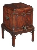 A George III mahogany wine cooler, circa 1760, in the manner of Thomas Chippendale, the hinged lid