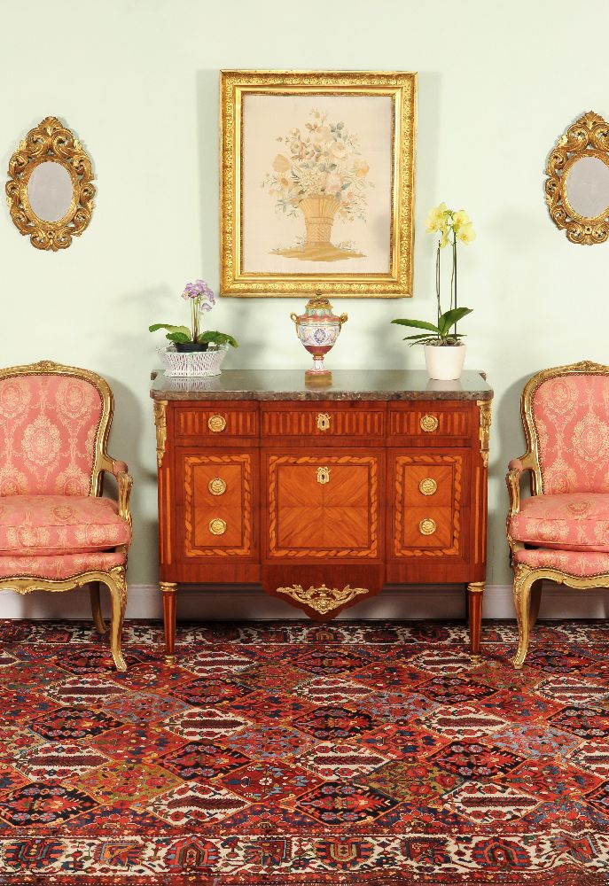 A French mahogany, parquetry, inlaid and gilt metal mounted commode in Louis XVI style, 19th