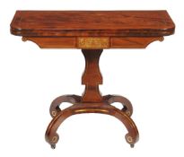 A Regency mahogany and brass marquetry folding card table, circa 1815, the folding rectangular top
