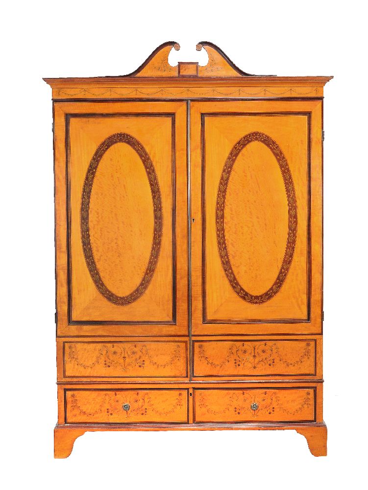 A George III satinwood and marquetry wardrobe, Channel Isles, circa 1790, decorated with marquetry