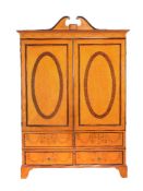 A George III satinwood and marquetry wardrobe, Channel Isles, circa 1790, decorated with marquetry